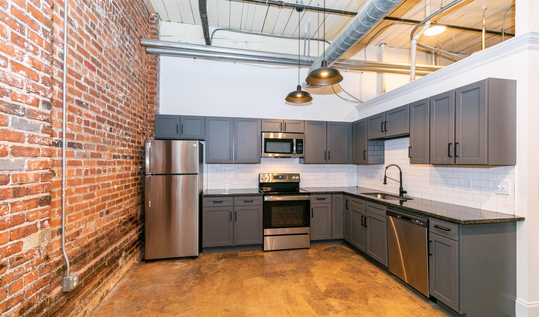 Spacious kitchens with thoughtful details a kitchen with stainless steel appliances