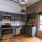 a kitchen with a brick wall